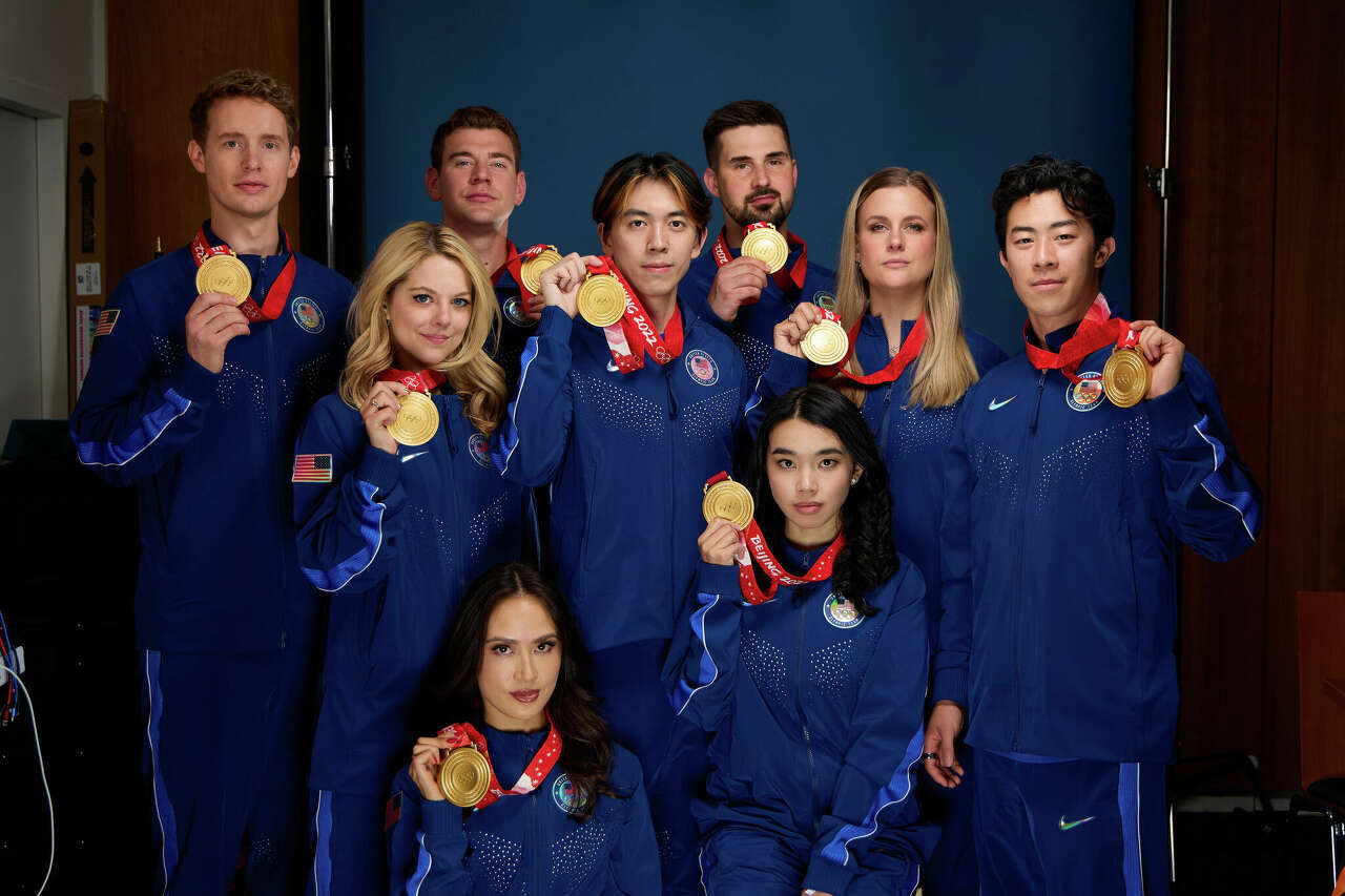 U.S. Olympians Evan Bates, Alexa Knierim, Brandon Frazier, Vincent Zhou, Zachary Donohue, Karen Chen, Madison Hubbell and Nathan Chen pose for a photo at the USA House at Paris 2024 on August 07, 2024 in Paris, France.