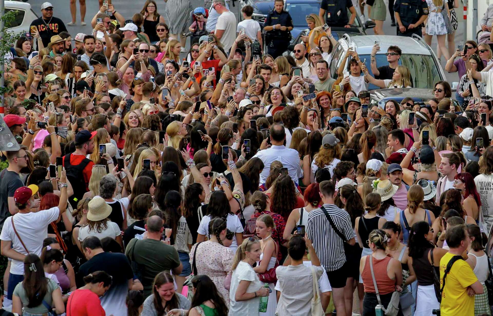 AP PHOTOS: Hundreds of Taylor Swift fans come together in Vienna after  concerts cancelled