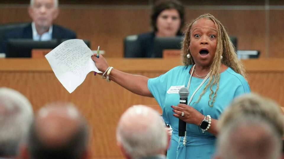 HISD trustee Myrna Guidry addresses attendees and board members to advocate against the $4.4 billion school board bond package during a meeting on Thursday, Aug. 8, 2024 in Houston.