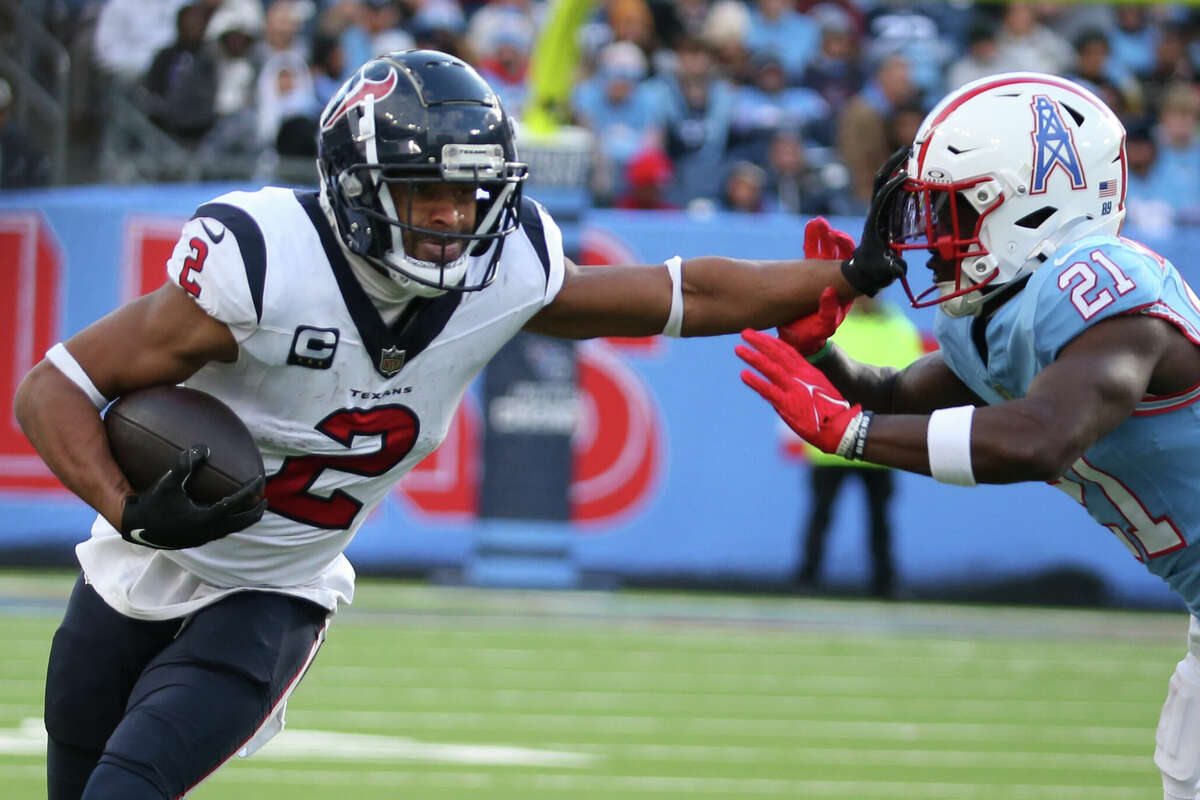 Houston Texans wide receiver Robert Woods (2) stiff arms Houston Texans cornerback Steven Nelson (21) during a game between the Tennessee Titans and Houston Texans, December 17, 2023 at Nissan Stadium in Nashville, Tennessee. 