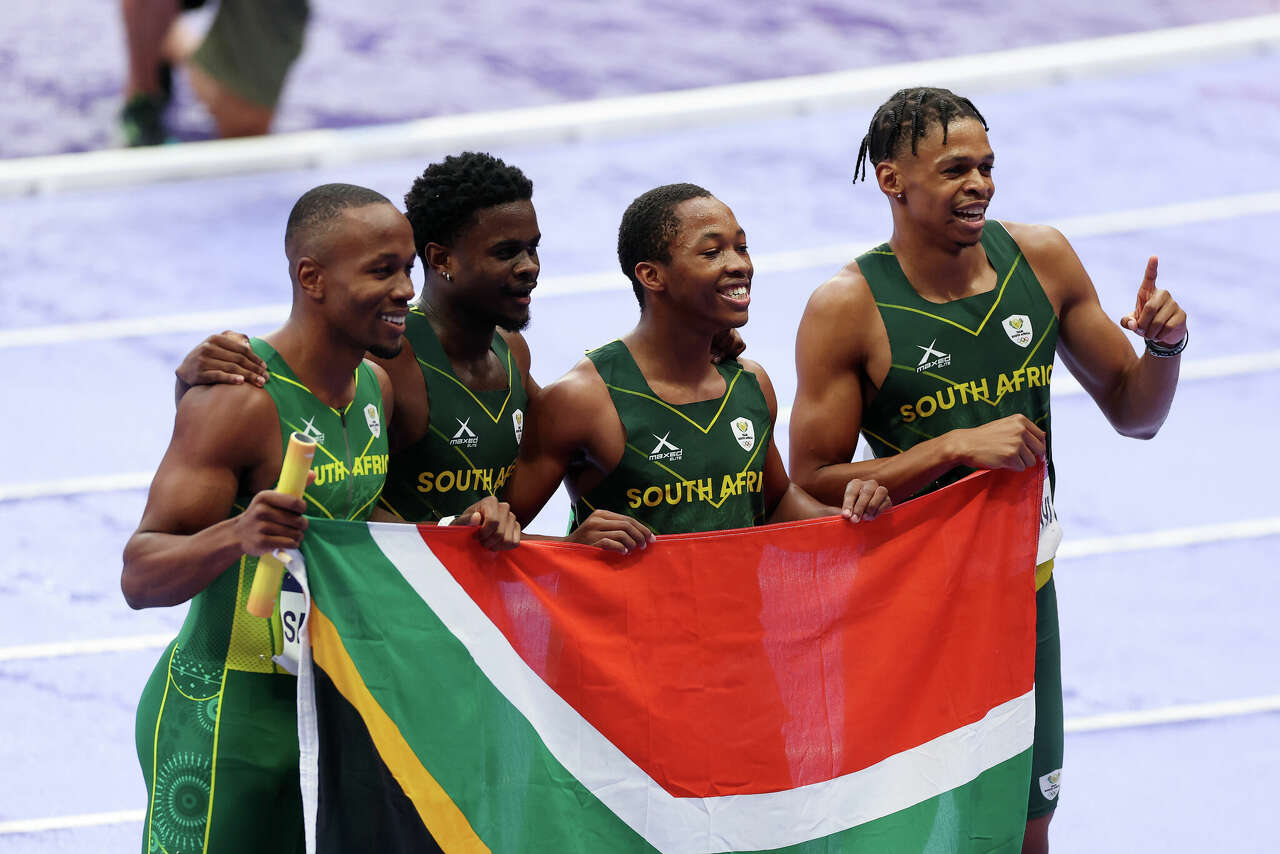 UH sprinter Shaun Maswanganyi, far right, celebrates silver in 4x100 relay with his South Africa teammates Bayanda Walaza, Bradley Nkoana and Akani Simbine.