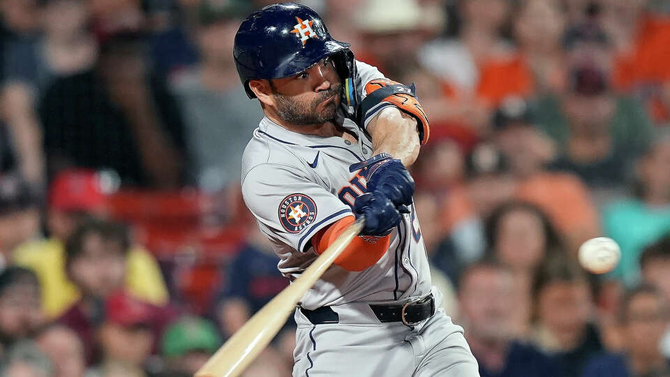 Houston Astros' Jose Altuve hits a two-run home run during the seventh inning of a baseball game against the Boston Red Sox, Friday, Aug. 9, 2024, in Boston. (AP Photo/Michael Dwyer)