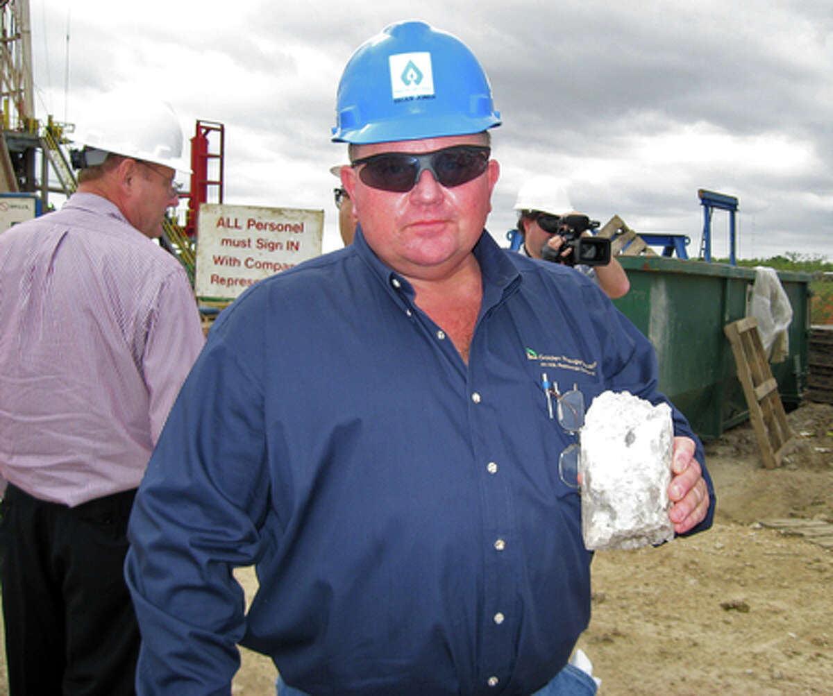 David Schultz, a vice president at Pivotal Energy Development, holds a chunk of compacted salt extracted from the future site of an artificial cavern where natural gas will be stored. Colin Guy/Beaumont Enterprise