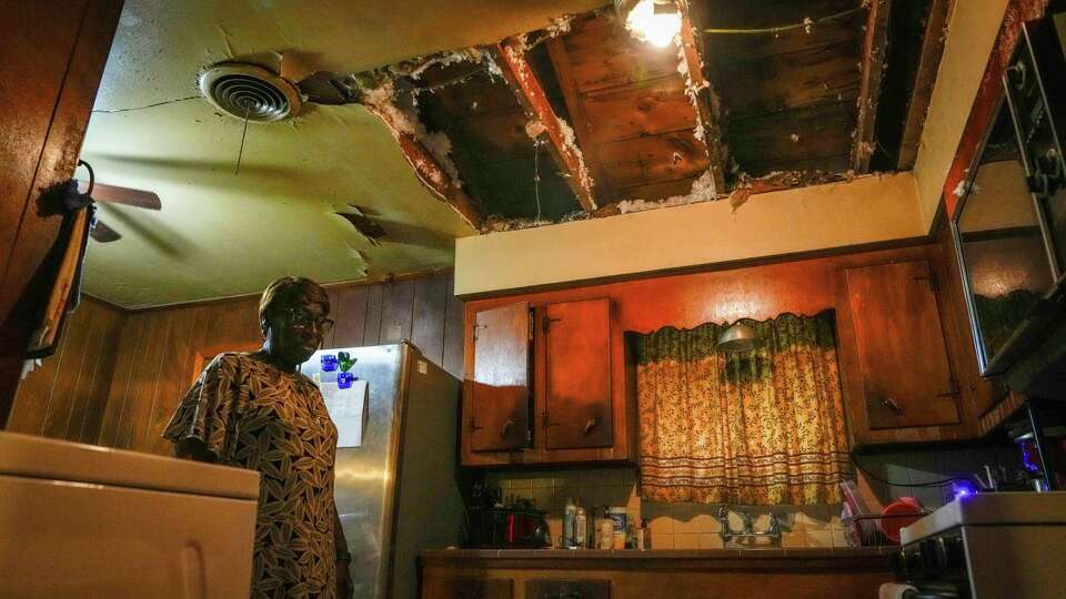 Months after the damaging storms, Derecho and Beryl, the home of Deborah Powell, 72, is still under repair from major water and wind damage, she is photographed in the kitchen of her home on Sunday, Aug. 11, 2024 in Houston.