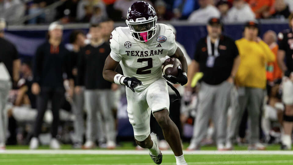 Texas A&M Aggies running back Rueben Owens (2) runs the ball during the TaxAct Texas Bowl between Texas A&M Aggies and Oklahoma State Cowboys on December 27, 2023, at NRG Stadium in Houston, Texas. (Photo by David Buono/Icon Sportswire via Getty Images)