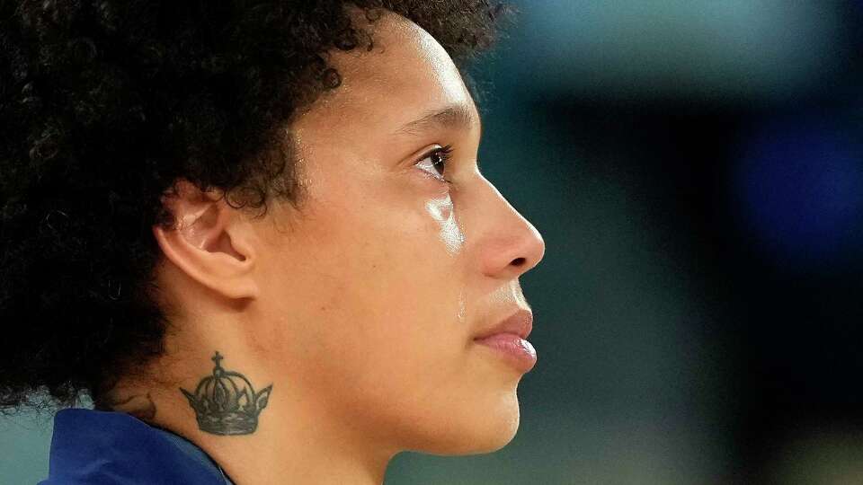 Tears stream down the face of United States' Brittney Griner during the national anthem after a women's gold medal basketball game at Bercy Arena at the 2024 Summer Olympics, Sunday, Aug. 11, 2024, in Paris, France. (AP Photo/Mark J. Terrill)