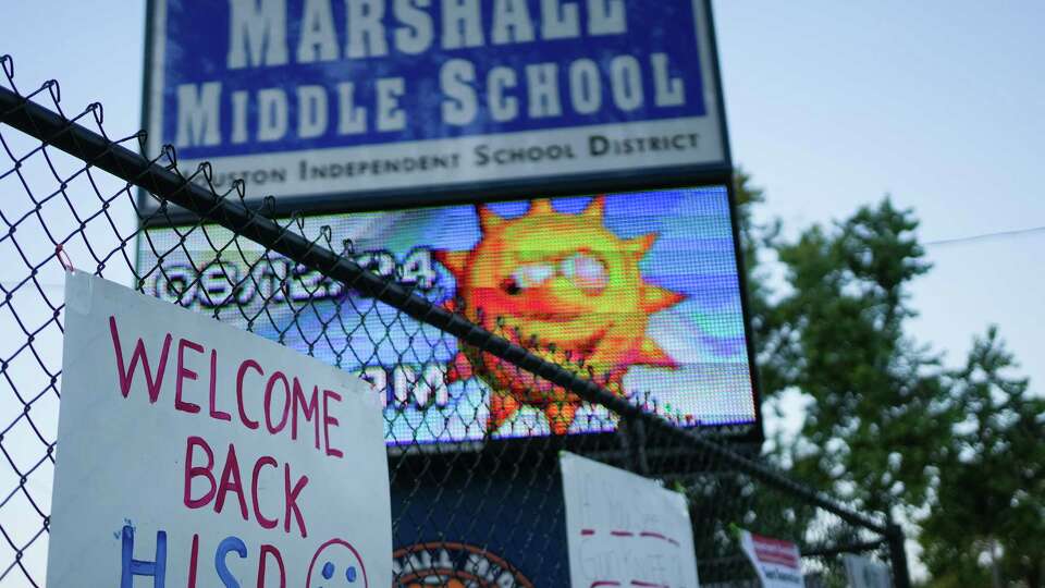 Signs greet Marshall Middle School students for their first day of school on Monday, Aug. 12, 2024 in Houston.