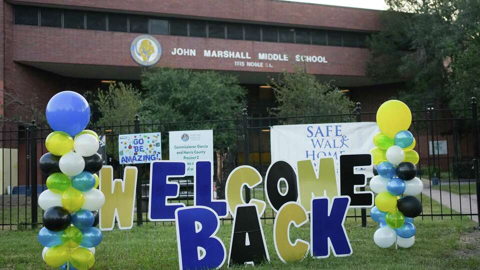 Signs greet Marshall Middle School students for their first day of school on Monday, Aug. 12, 2024 in Houston.