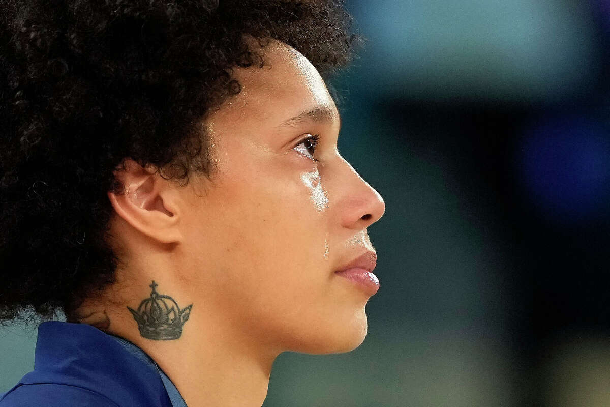 Tears stream down the face of United States' Brittney Griner during the national anthem after a women's gold medal basketball game at Bercy Arena at the 2024 Summer Olympics, Sunday, Aug. 11, 2024, in Paris, France. 