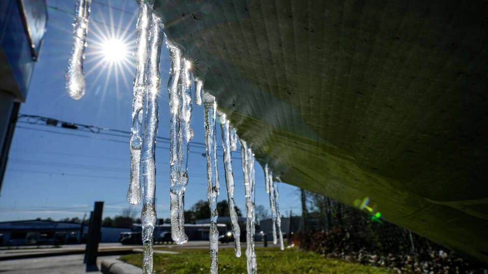 Icicles are formed on a sign at a convenience store along FM 2920 on Jan. 16 in Spring. 