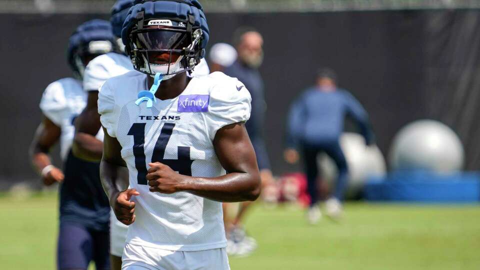 Houston Texans cornerback Kamari Lassiter jogs across the field during an NFL training camp Tuesday, Aug. 13, 2024, in Houston.