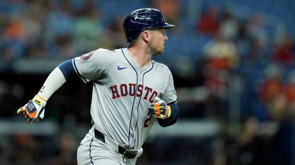 Houston Astros' Alex Bregman watches his home run off Tampa Bay Rays starting pitcher Shane Baz during the fifth inning of a baseball game Tuesday, Aug. 13, 2024, in St. Petersburg, Fla. (AP Photo/Chris O'Meara)