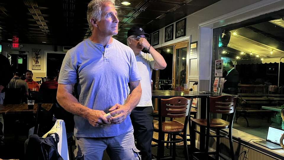 Navy Veteran Matthew Corey watches the results from Tuesday's Republican Senate primary election at his restaurant, the One Wood Pub, in East Hartford. 