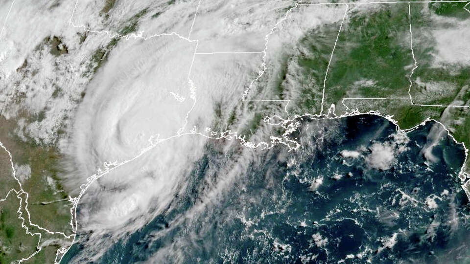 This weather satellite image taken on July 8 and provided by NOAA shows Tropical Storm Beryl over Texas. Hurricane Beryl swept into Texas early Monday with heavy rainfall and powerful winds, knocking out power to millions of homes and businesses.