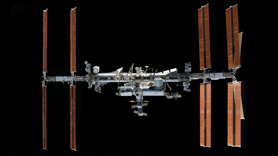 This photo provided by NASA, taken from the SpaceX Crew Dragon Endeavour, shows the International Space Station on Nov. 8, 2021. Those in the Houston metro area will be able to see the structure pass overhead before dawn on Saturday.