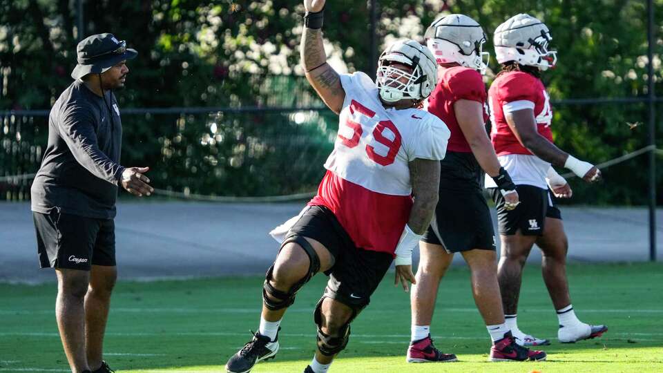 Houston offensive lineman Demetrius Hunter (59) celebrates a play during practice on Thursday, Aug. 15, 2024 in Houston. The Cougars open their season on Aug. 31 at home against UNLV.