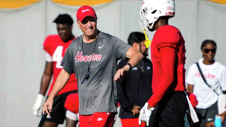 Houston head coach Willie Fritz, left, talks to defensive back Latrell McCutchin Sr. during practice on Thursday, Aug. 15, 2024 in Houston. The Cougars open their season on Aug. 31 at home against UNLV.