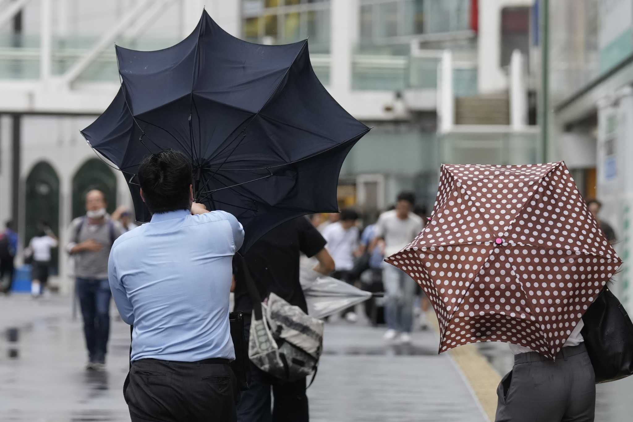 Evacuation ordered in northern Japan, power out, flights, trains