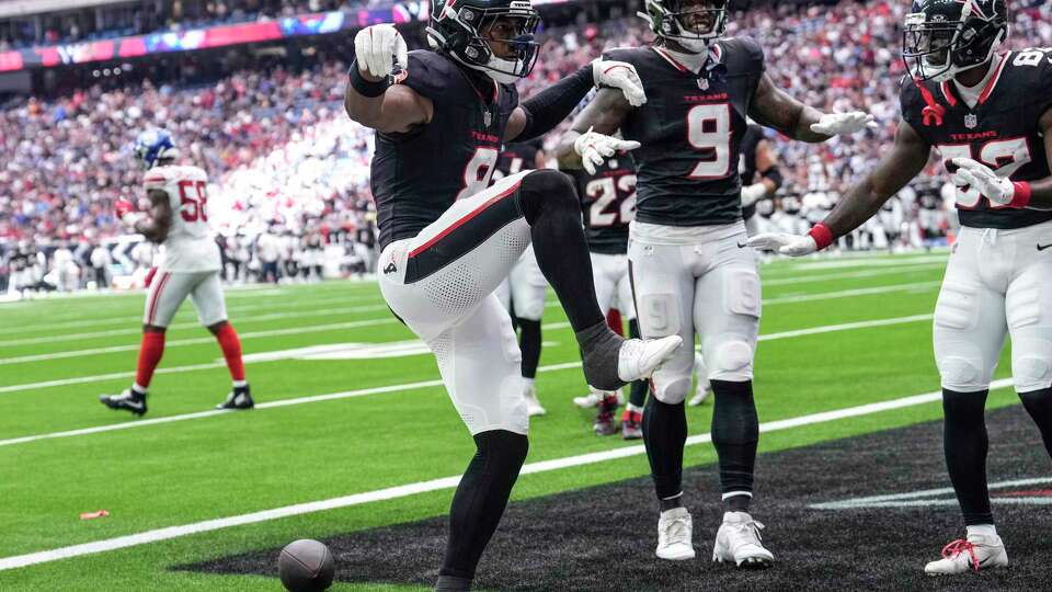 Houston Texans wide receiver John Metchie III (8) celebrates a touchdown reception against the New York Giants during the first half of an NFL preseason football game Saturday, Aug. 17, 2024, in Houston.