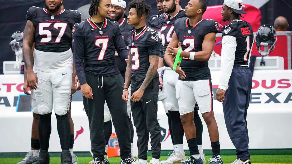 Houston Texans Blake Fisher (57), C.J. Stroud (7), Tank Dell (3), Jarrett Patterson (54), Robert Woods (2) and Stefon Diggs (1) stand together on the sidelines during the second half of an NFL preseason football game against the New York Giants Saturday, Aug. 17, 2024, in Houston.