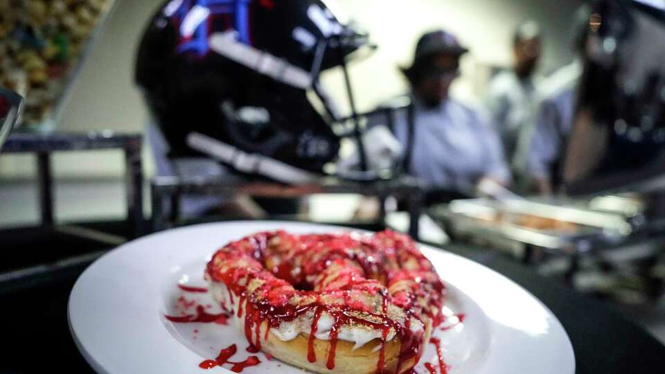 A strawberry cheesecake dessert pretzel is shown at NRG Stadium on Monday, Aug. 19, 2024 in Houston. The pretzel is one of the more than 80 new food and beverage options during Texans game this season at NRG Stadium.