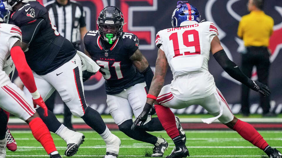 Houston Texans running back Dameon Pierce (31) runs the ball against the New York Giants during the first half of an NFL preseason football game Saturday, Aug. 17, 2024, in Houston.