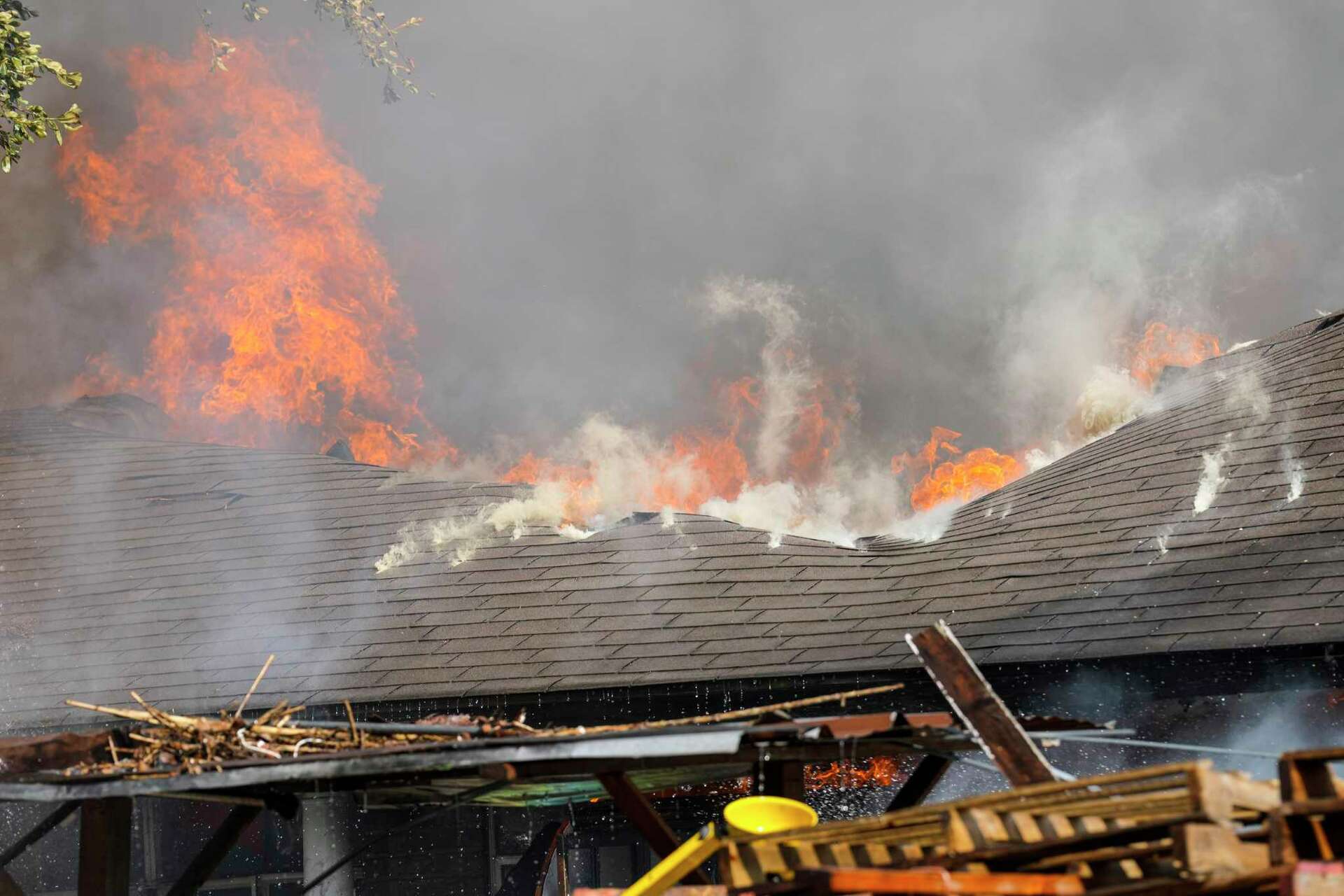 Firefighters working to contain large house fire in southwest Houston