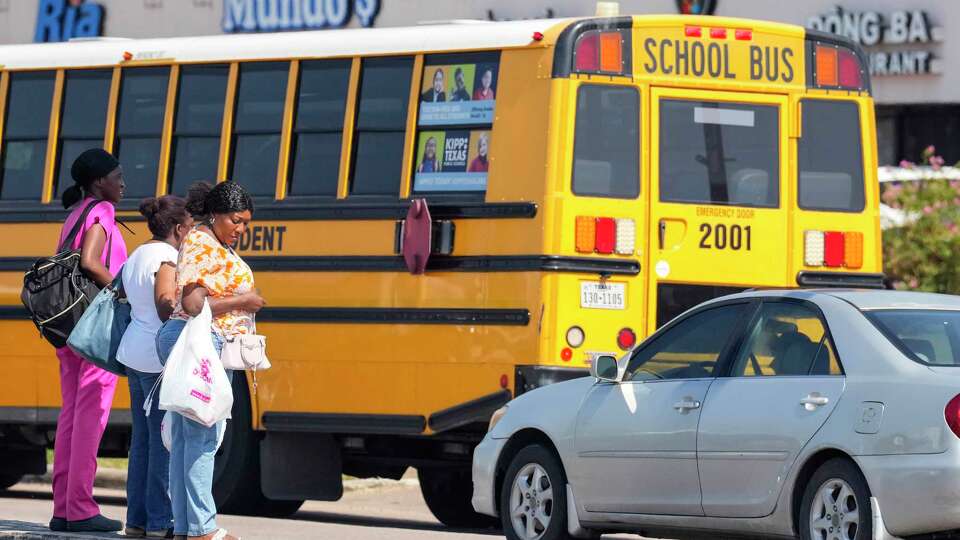 Pedestrians cross the street at the intersection of Beechnut and Wilcrest on Tuesday, Aug. 20, 2024 in Houston. The intersection is one that is among the hot spots for crashes related to children, including two fatalities.