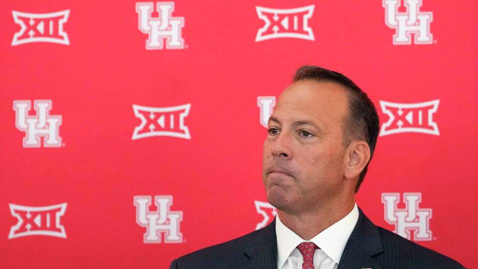 University of Houston athletic director Eddie Nuñez sits at the podium as he is introduced as the school’s 14th athletic director on Wednesday, Aug. 21, 2024 in Houston. Nuñez comes to Houston after holding leadership positions at New Mexico and LSU. He was the athletic director at New Mexico.
