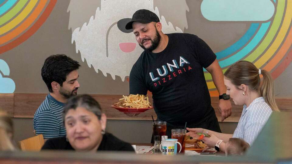 Servers wait on customers during lunch at Barnaby’s Cafe on Binz Street Thursday, Aug. 22, 2024 in Houston.