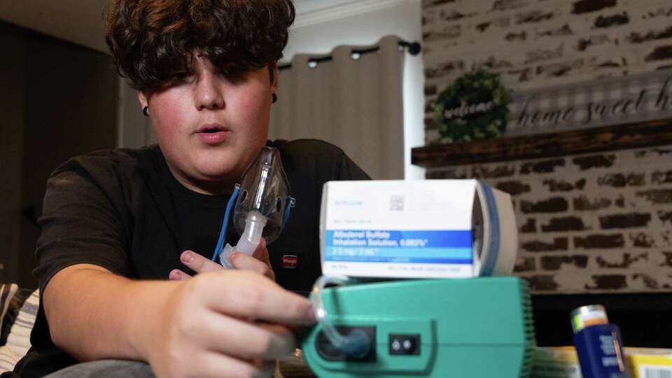 Paxton Hagner, a sophomore in Cy-Fair ISD, describes the how his nebulizer breathing treatments work, Friday, Aug. 24, 2024, in Houston. Paxton’s mother, Heather, has had trouble getting the school to approve administering his life-saving breathing medication, and other meds, to her autistic son, due to a recent reversal in a district policy, implemented based on controversial new guidelines from the Texas School Nurses Organization.