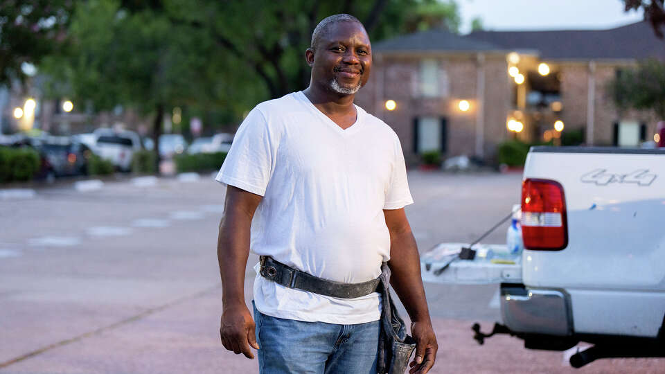 Candido Batiz poses by his truck after a day’s work remodeling a house in Houston, TX on August 23, 2024. Batiz has suffered health consequences from working in the Texas heat. The U.S. Department of Labor has released a proposed rule to protect millions of workers from health risks due to extreme heat.