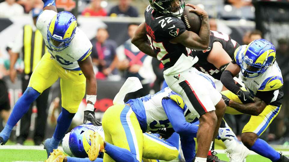 Houston Texans running back Cam Akers (22) spins out of a tackle during the second half of a NFL preseason football game at NRG Stadium, Saturday, Aug. 24, 2024, in Houston.