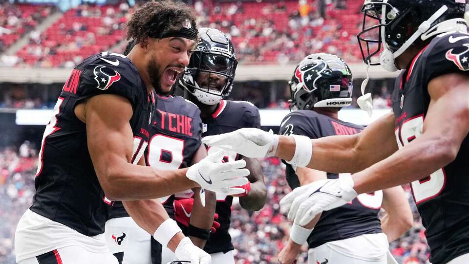 Houston Texans wide receiver Xavier Hutchinson, left, celebrates with wide receiver Johnny Johnson III after his 10-yard touchdown during the second half of a NFL preseason football game at NRG Stadium, Saturday, Aug. 24, 2024, in Houston.