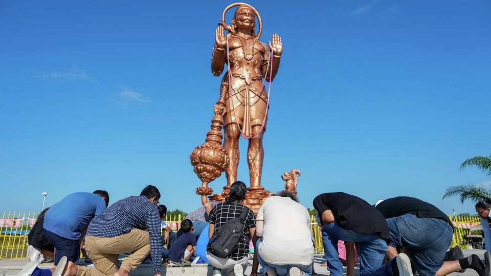 A faith based group protests the new statue of Hanuman at the Shri Ashtalakshmi Temple on Sunday, Aug. 25, 2024, in Sugar Land. The group prayed, marched around the statue for several minutes and offered prayer to members of the Hindu Temple.