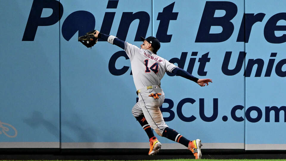 Mauricio Dubón #14 of the Houston Astros makes a running catch on a fly ball off the bat of Ramón Urías of the Baltimore Orioles in the seventh inning at Oriole Park at Camden Yards on August 25, 2024 in Baltimore, Maryland. Dubón came out of the game after crashing into the wall on the play. (Photo by Greg Fiume/Getty Images)