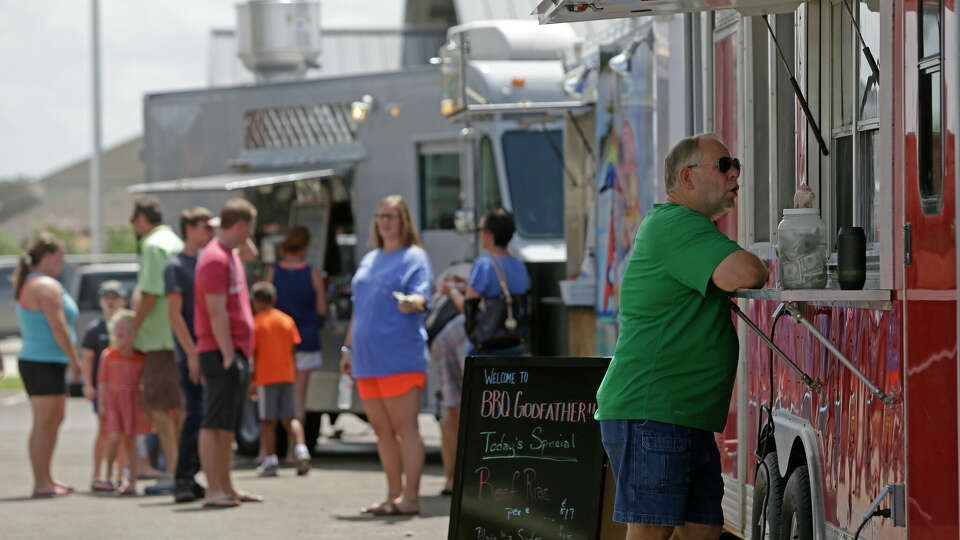 People order food at a food truck park in Houston. 