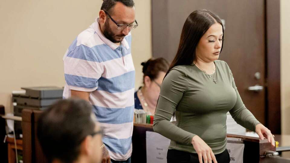 Abilene Schnieder and husband Christian Alexander Moreno stand before State District Judge Velia Meza to enter plea bargain agreements after their pit bulls killed an elderly Air Force veteran last year on Tuesday, Aug. 27, 2024, in San Antonio, Texas.