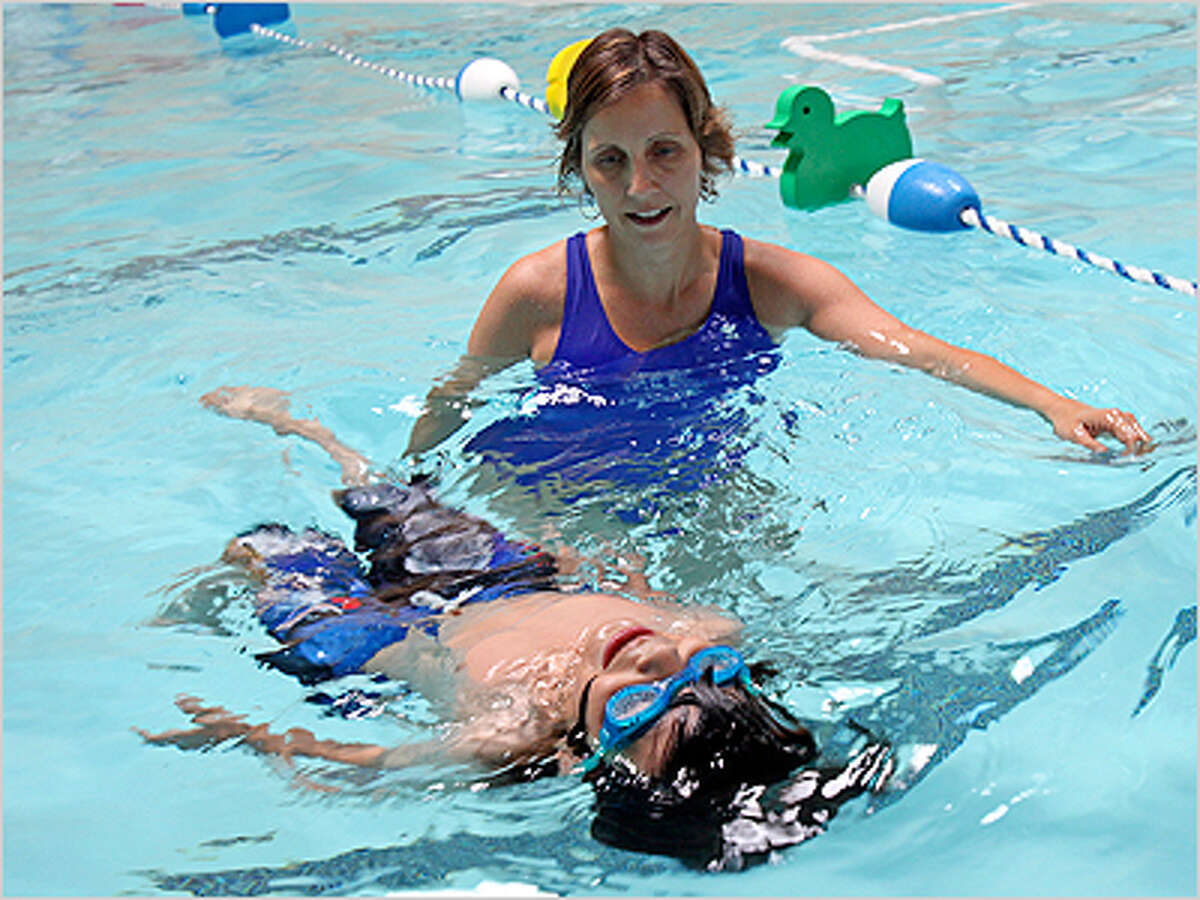 Families stress swimming safety in world record shot
