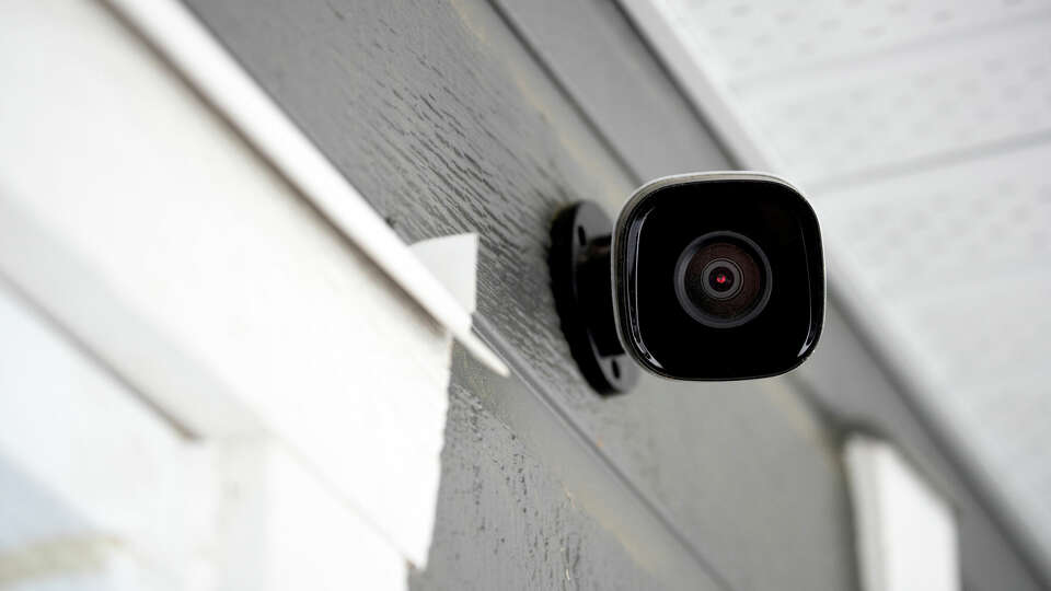 Black cctv outside the building, home security system