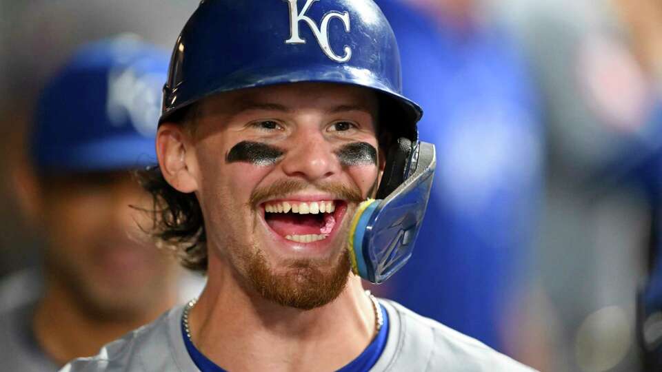 Kansas City Royals' Bobby Witt Jr. celebrates a grand slam by Salvador Perez during the sixth inning of the second game of a baseball doubleheader against the Cleveland Guardians, Monday, Aug. 26, 2024, in Cleveland. (AP Photo/Nick Cammett)