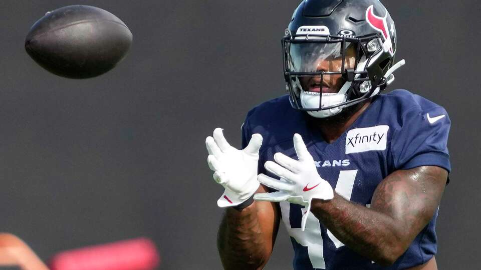 Houston Texans running back British Brooks (44) reaches out to make a catch during practice on Wednesday, Aug. 28, 2024, at Houston Methodist Training Center in Houston.