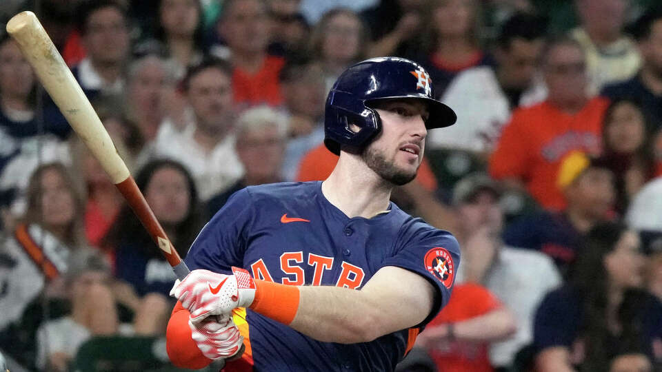 Houston Astros' Kyle Tucker (30) hits a double during the first inning of an MLB baseball game at Minute Maid Park on Wednesday, May 15, 2024, in Houston.