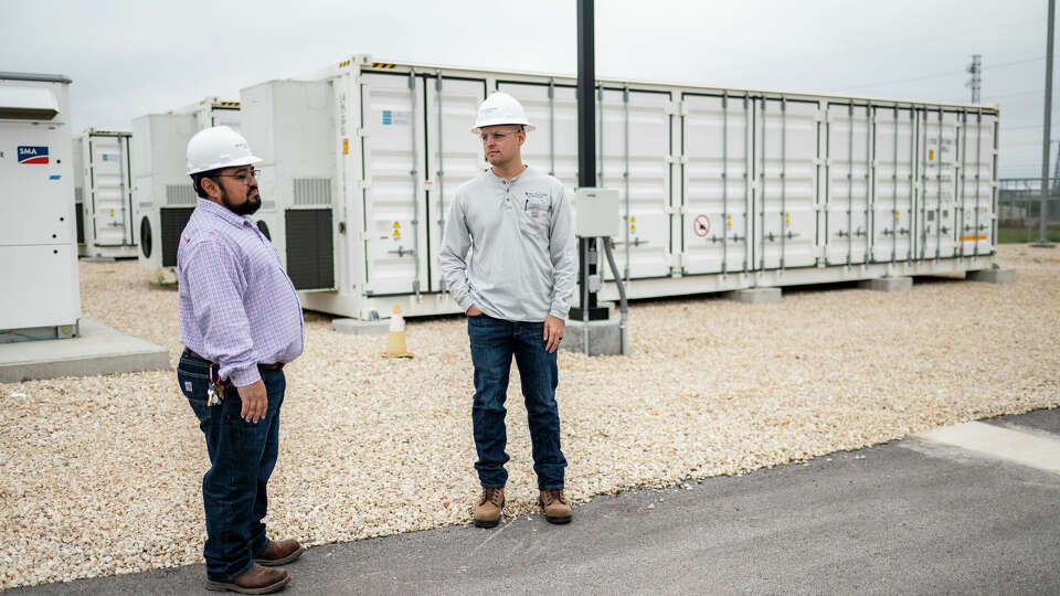 Workers at a battery storage site outside Pflugerville. A new report shows clean energy booming in the state.