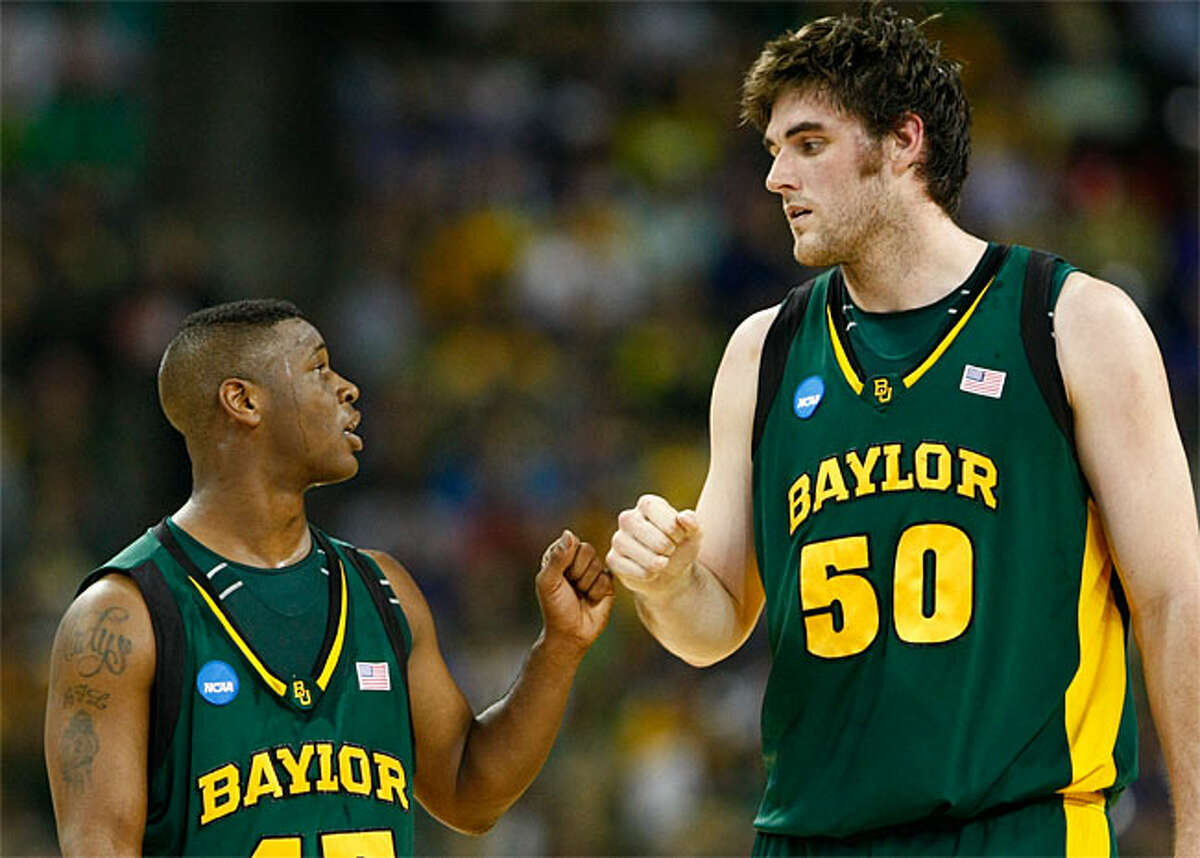 Baylor guard Tweety Carter (45) and center Josh Lomers (50) share a moment during the first half of the 2010 NCAA Men's Basketball South Regional Championship men's college basketball game March 28 at Houston's Reliant Stadium.