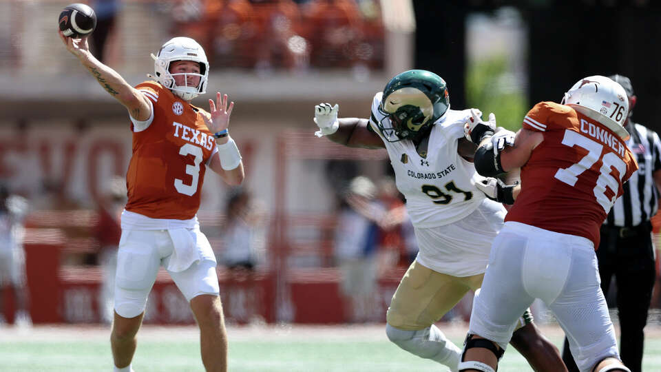 Quinn Ewers #3 of the Texas Longhorns throws a pass in the second quarter under pressure by James Mitchell #91 of the Colorado State Rams at Darrell K Royal-Texas Memorial Stadium on August 31, 2024 in Austin, Texas. (Photo by Tim Warner/Getty Images)