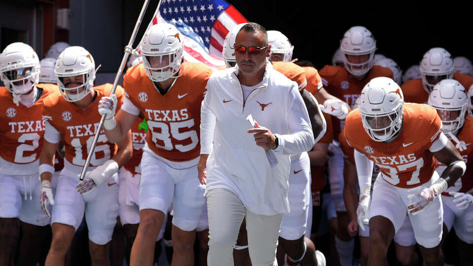 Texas head coach Steve Sarkisian, center right, takes the field with his team before an NCAA college football game against Colorado State in Austin, Texas, Saturday, Aug. 31, 2024. (AP Photo/Eric Gay)