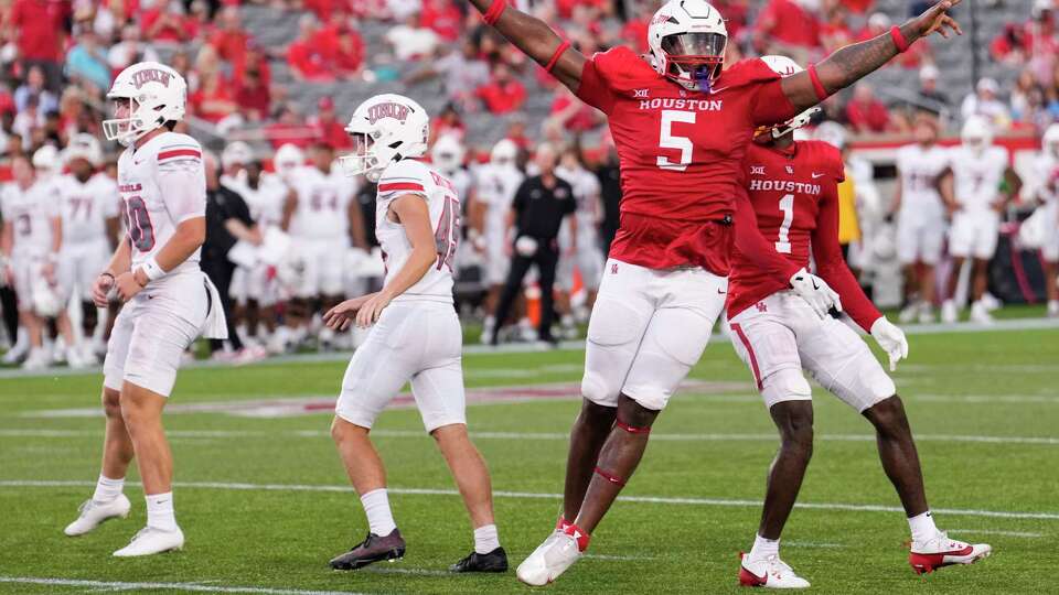 Houston defensive lineman Keith Cooper Jr. (5) reacts after UNLV place kicker Caden Chittenden (45) missed a field goal attempt during the first half of an NCAA college football game Saturday, Aug. 31, 2024, in Houston.