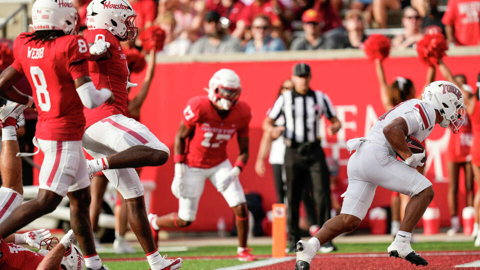 UNLV wide receiver Jacob De Jesus (21) breaks past the Houston defense for a touchdown during the first half of an NCAA college football game Saturday, Aug. 31, 2024, in Houston.