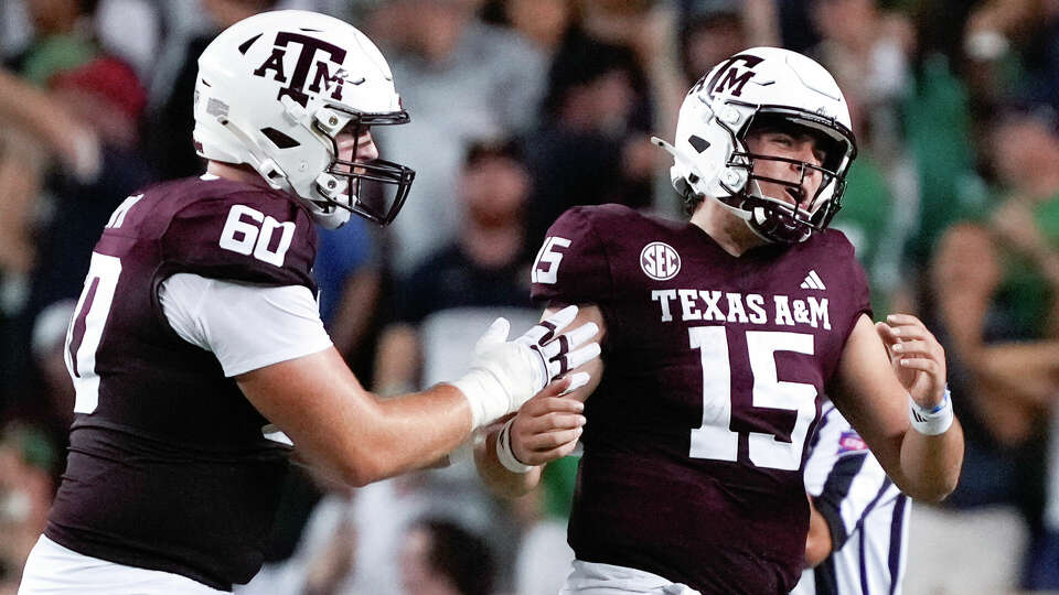 Texas A&M Aggies quarterback Conner Weigman (15) reacts alongside offensive lineman Trey Zuhn III (60) after throwing his second interception during the second quarter of a non-conference college football game at Kyle Field, Saturday, Aug. 31, 2024, in College Station.